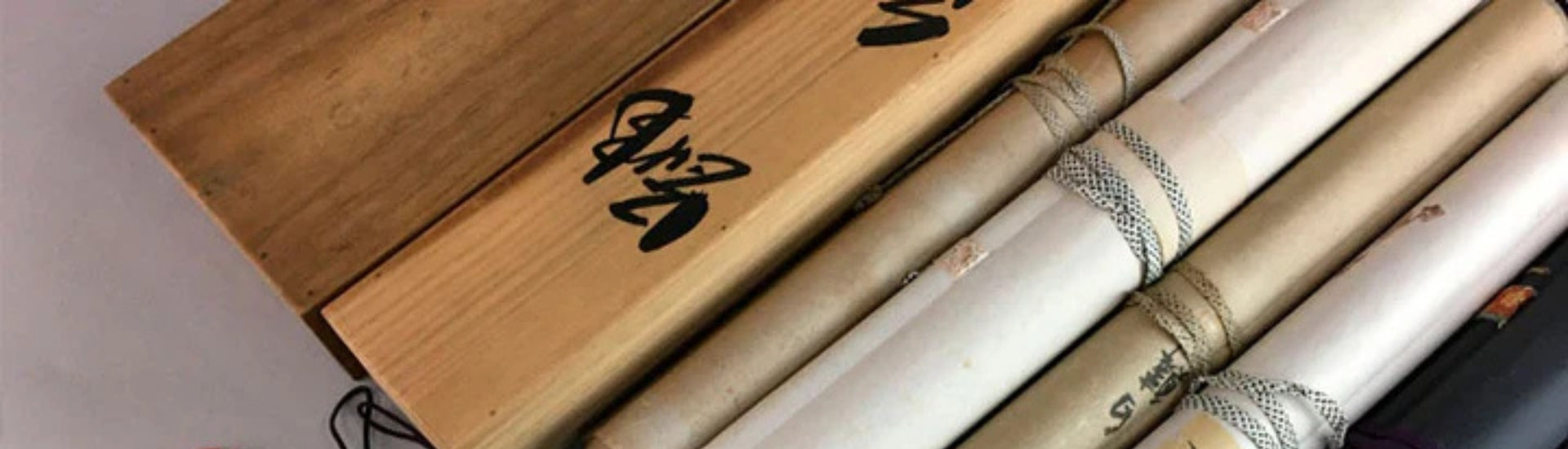 Vintage Japanese hanging scrolls (kakejiku) with wooden storage box and calligraphy detail