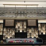 The display wall at The Ritz-Carlton, Aruba—warm light, clean lines, and a lot of history behind the glass | Chidori Vintage